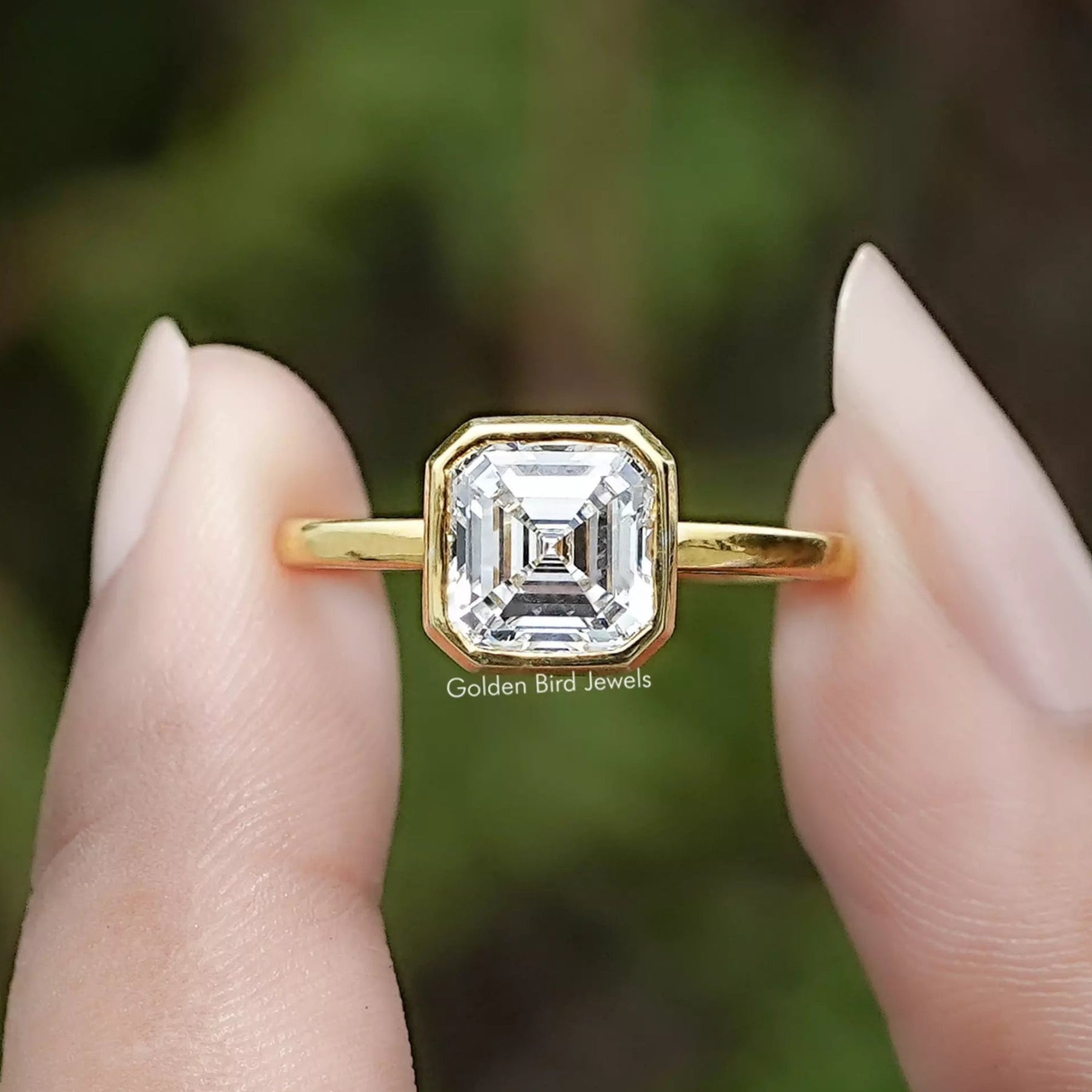 Bezel Set Asscher Cut Lab Diamond Solitaire Ring In Two Fingers