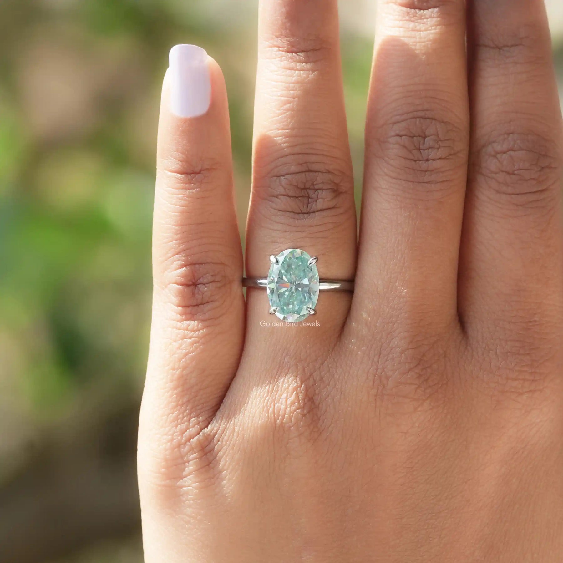 Top View Of Blue Oval Cut Moissanite Solitaire Ring
