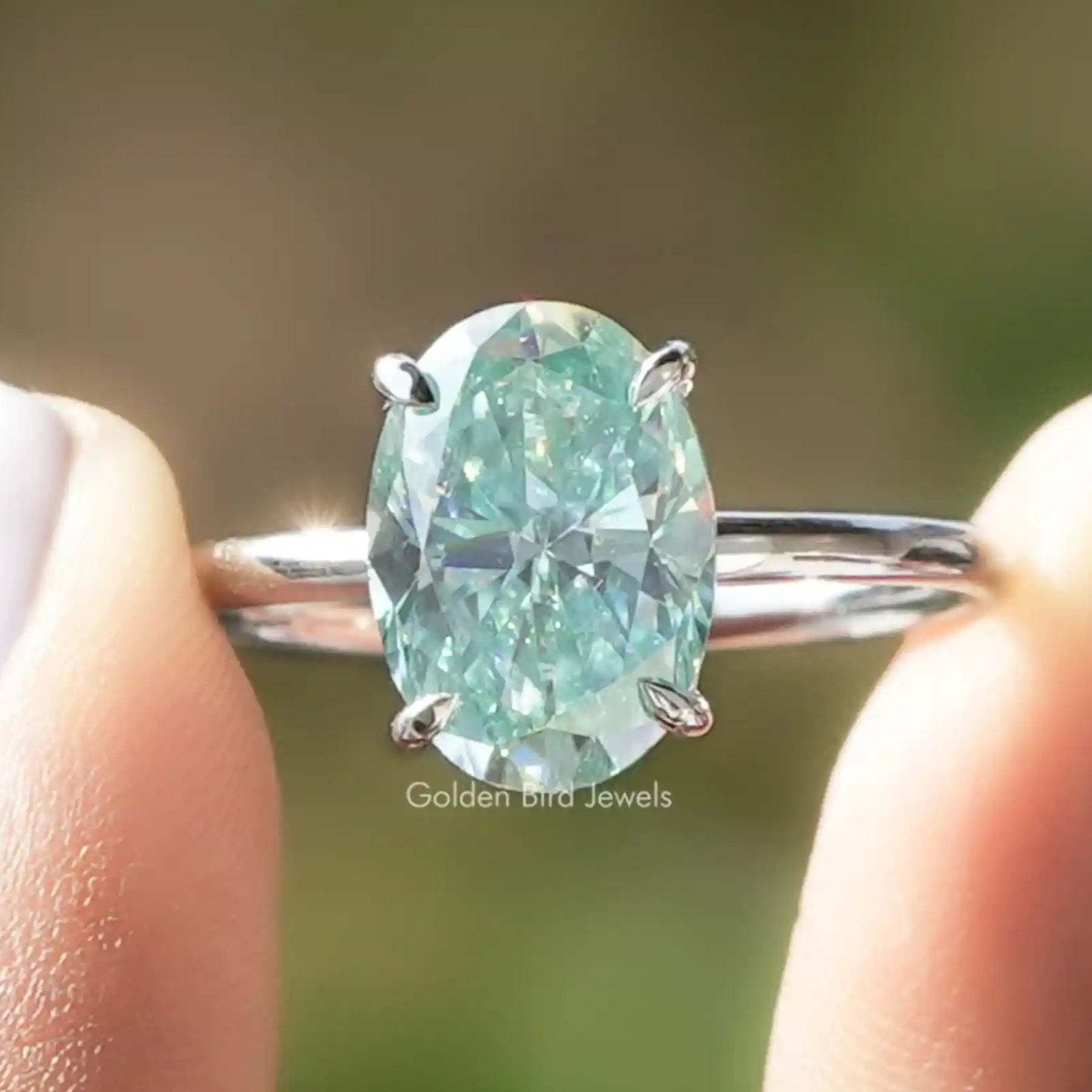 Front View of Blue Oval Cut Moissanite Solitaire Ring
