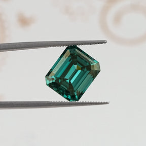 In Tweezer View Of Old Mine Emerald Cut Loose Moissanite Stone
