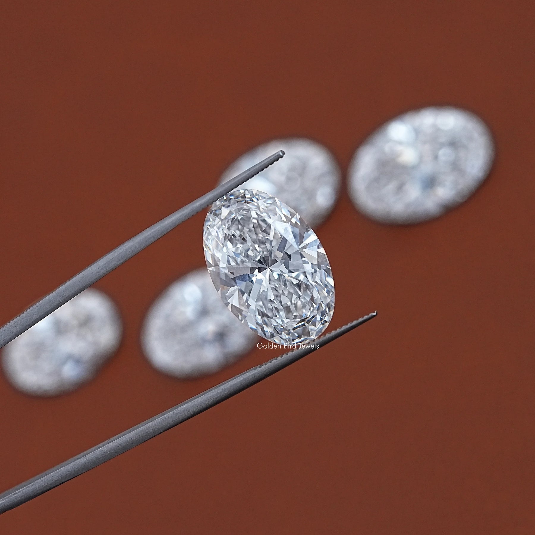 In Tweezer View Of Oval Cut Lab Loose Diamond 
