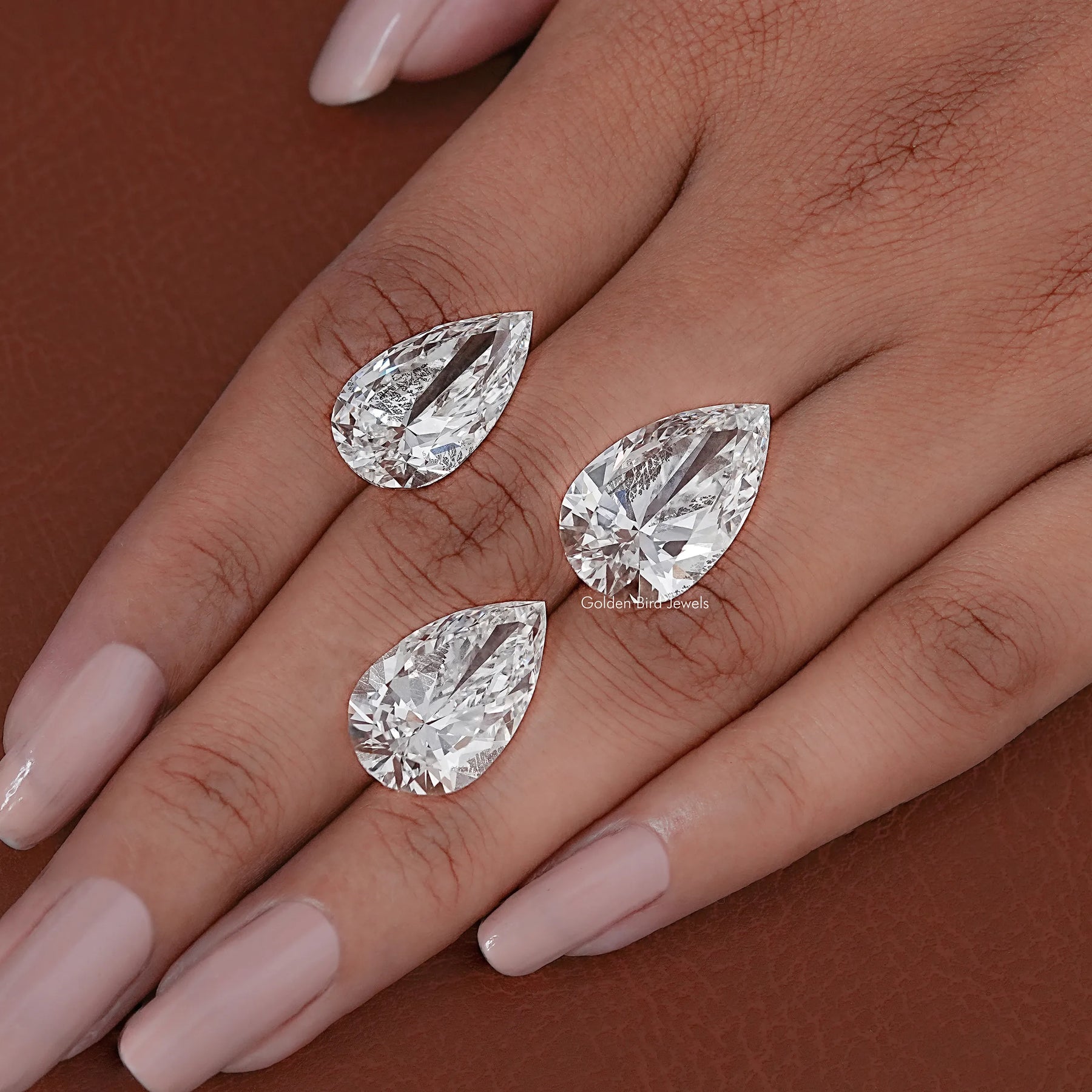 In hand Showing View Of Pear Cut Lab Diamond 
