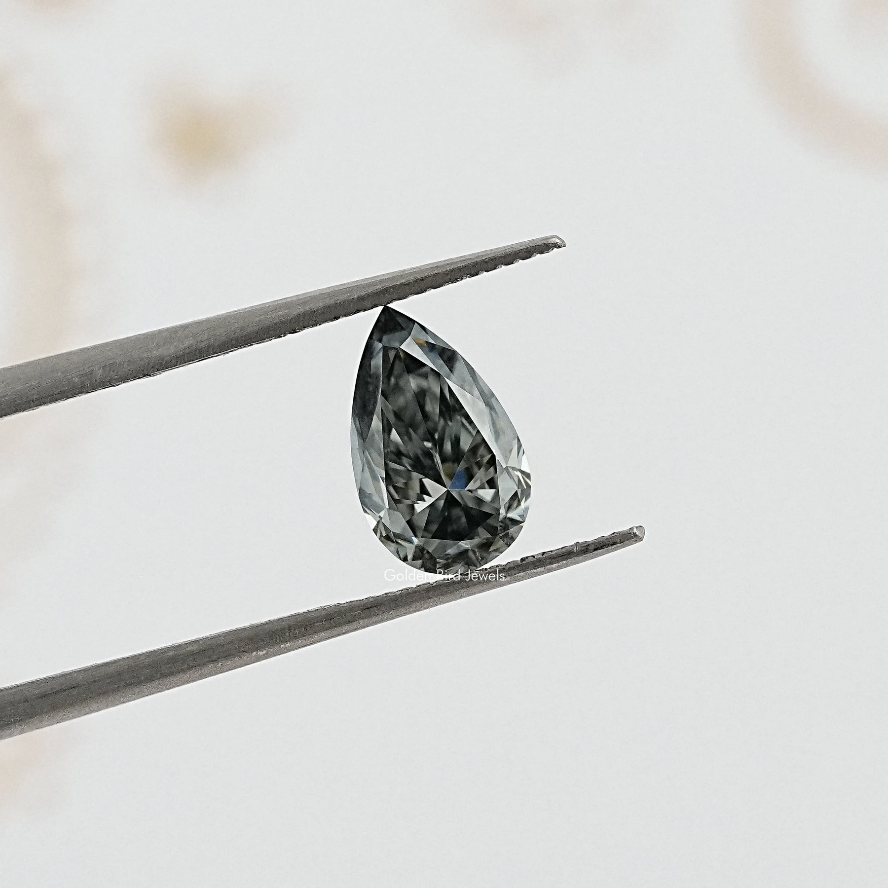 tweezers  View of Pear Cut Loose moissanite