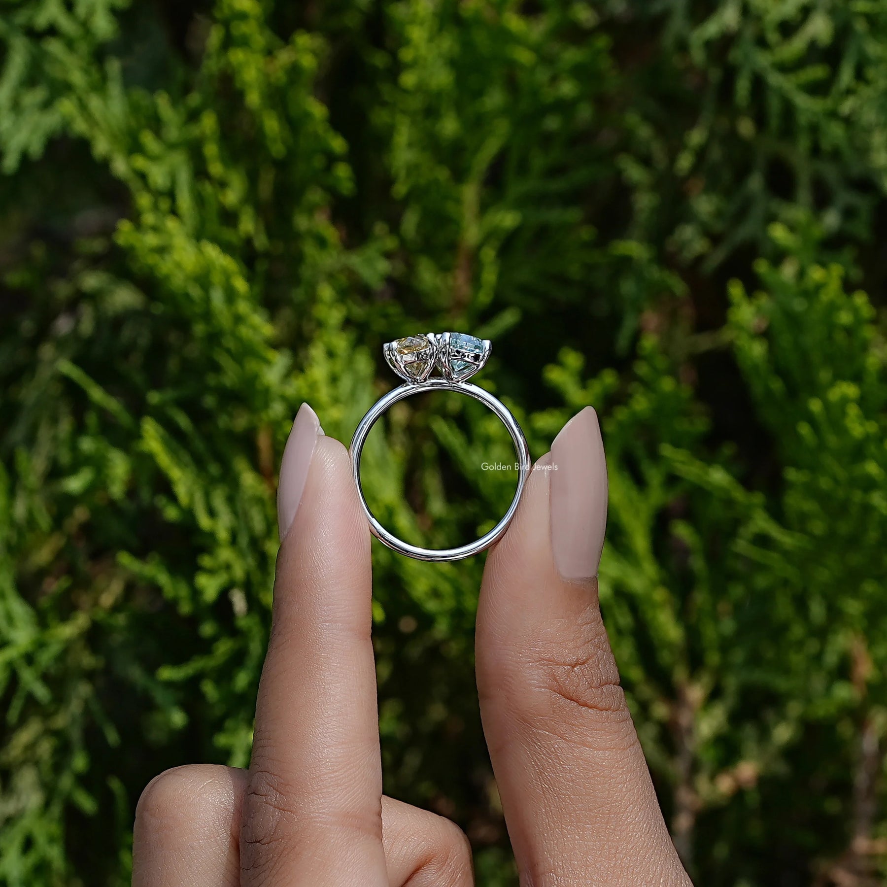In hand showing view of moissanite Ring	 		