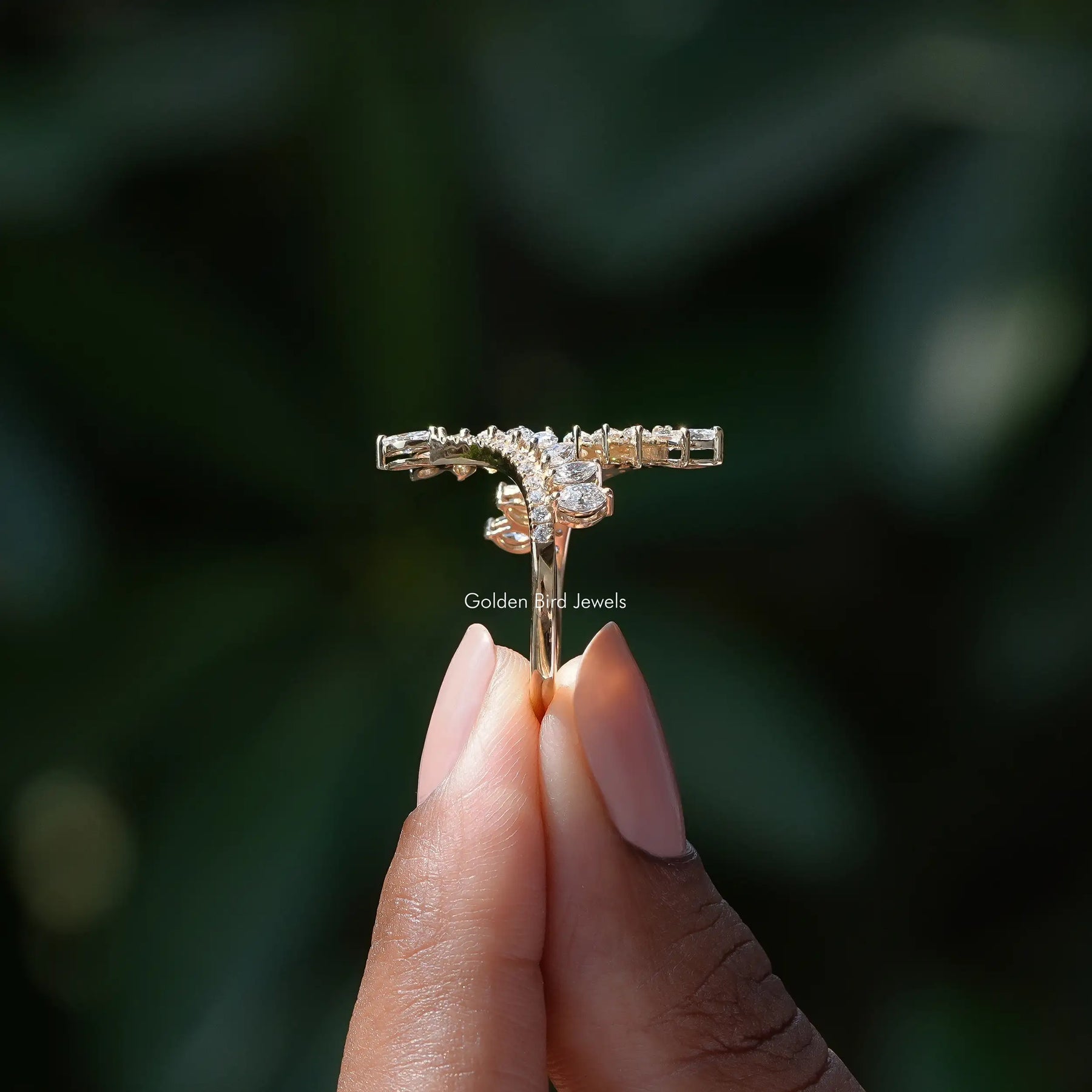 Side View of Marquise Cut Bypass Set Ring In two fingers