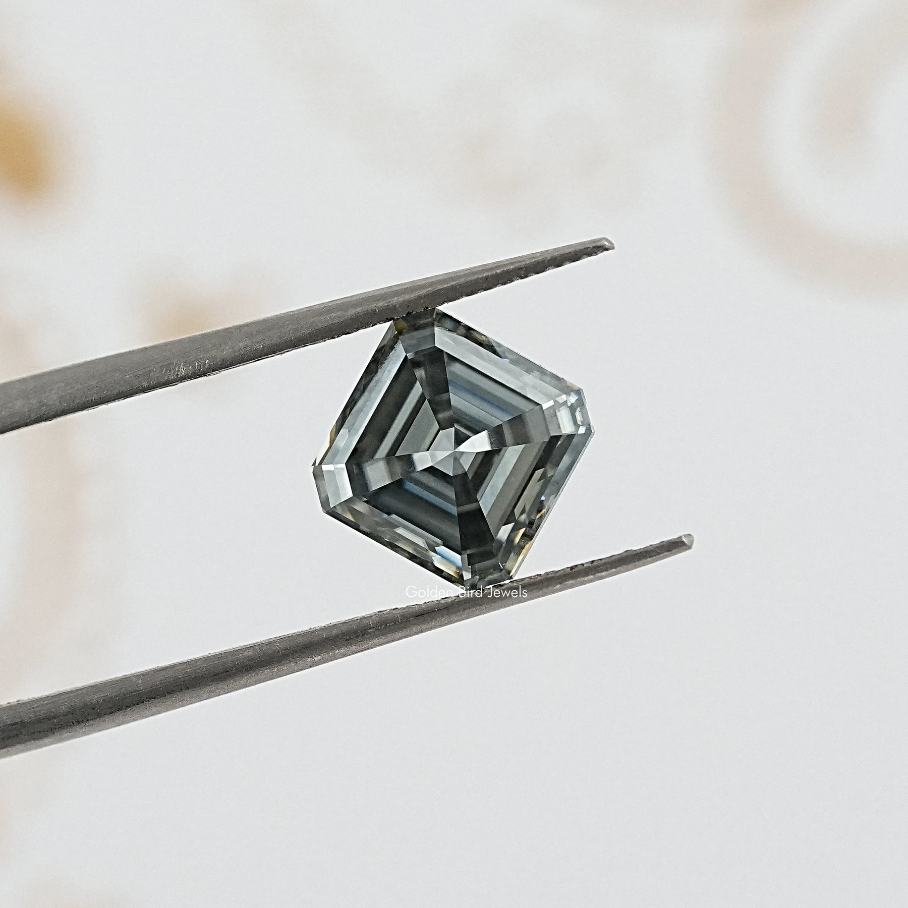 tweezers  View of Gray Asscher Cut Moissanite 