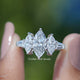 Marquise Lab Grown Diamond Five Stone Ring Held Between Fingers