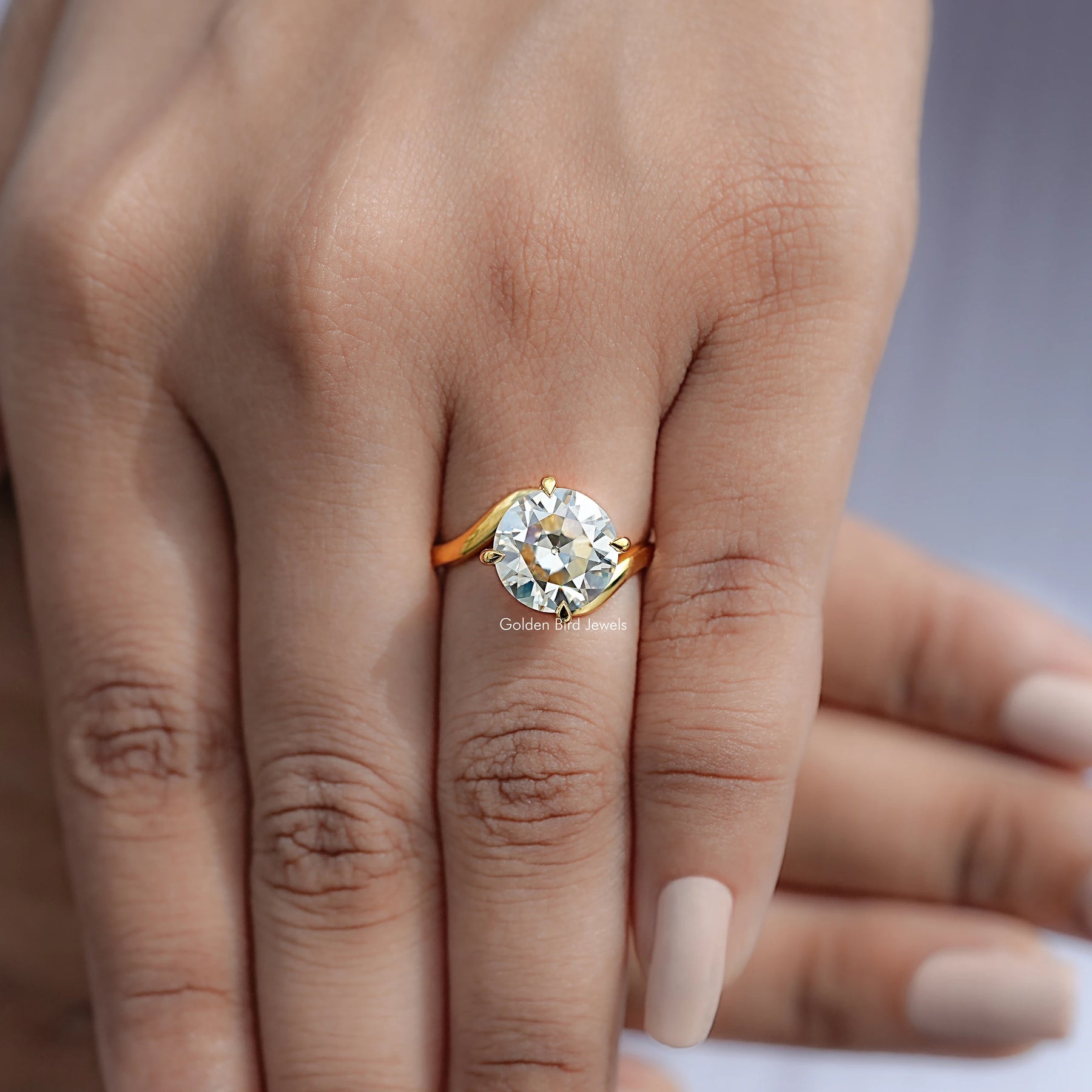 View of Round Cut Solitaire Engagement Ring in prongs setting