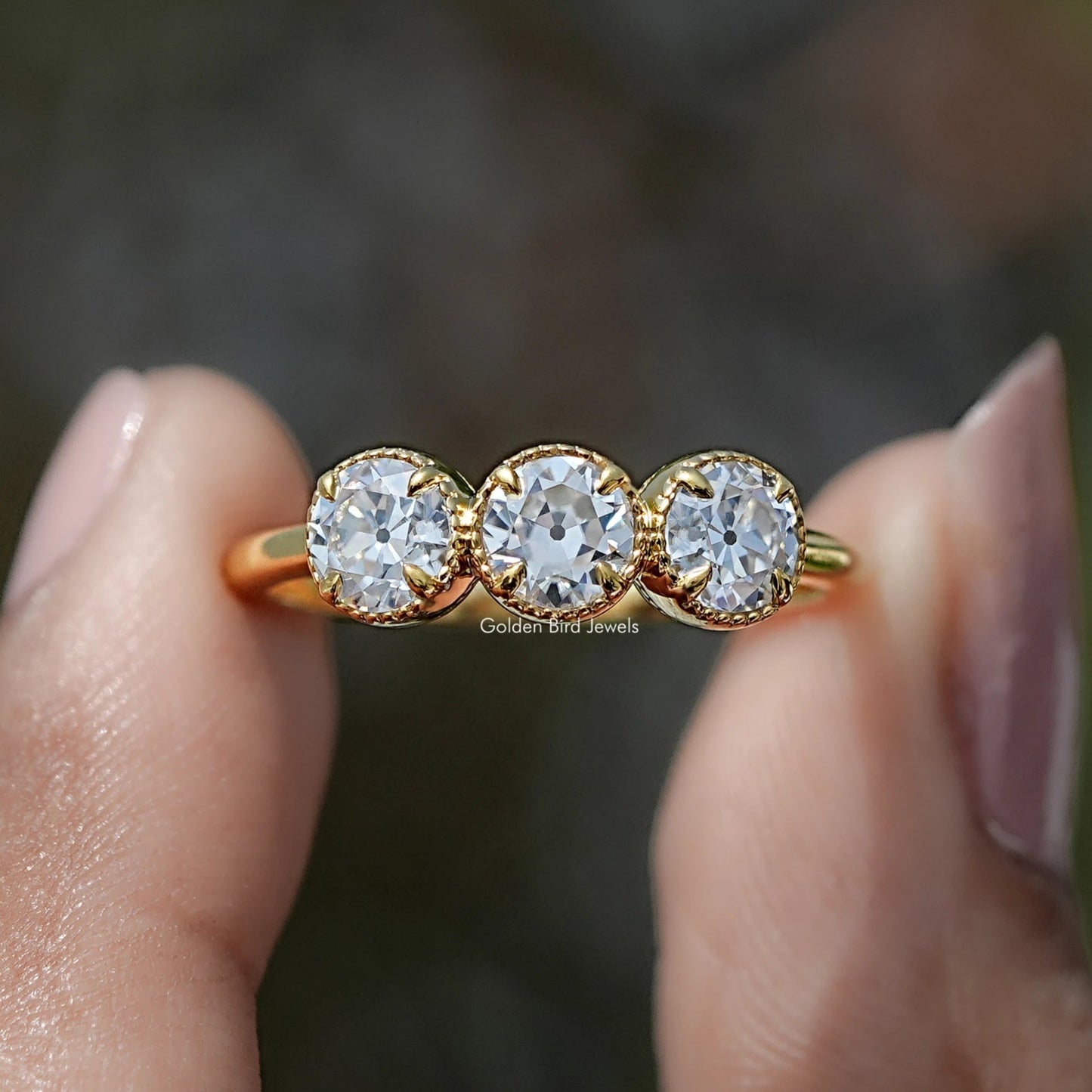 Front view of Old European Cut Round Moissanite Three Stone Ring