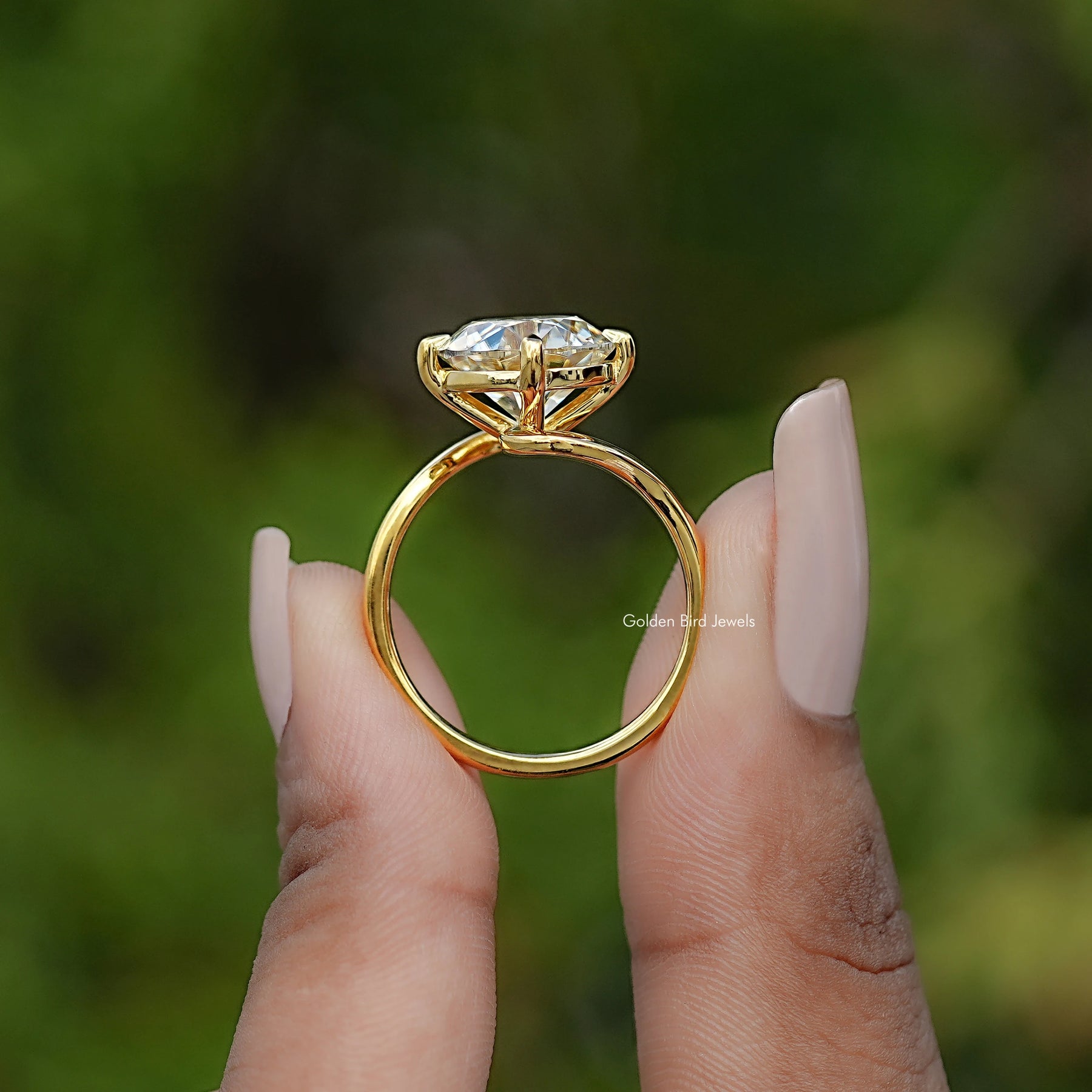 Back view of Round Cut Solitaire Engagement Ring in secure setting