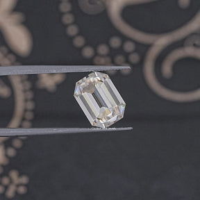 In Tweezer View Of Old Mine Emerald Loose Moissanite Stone