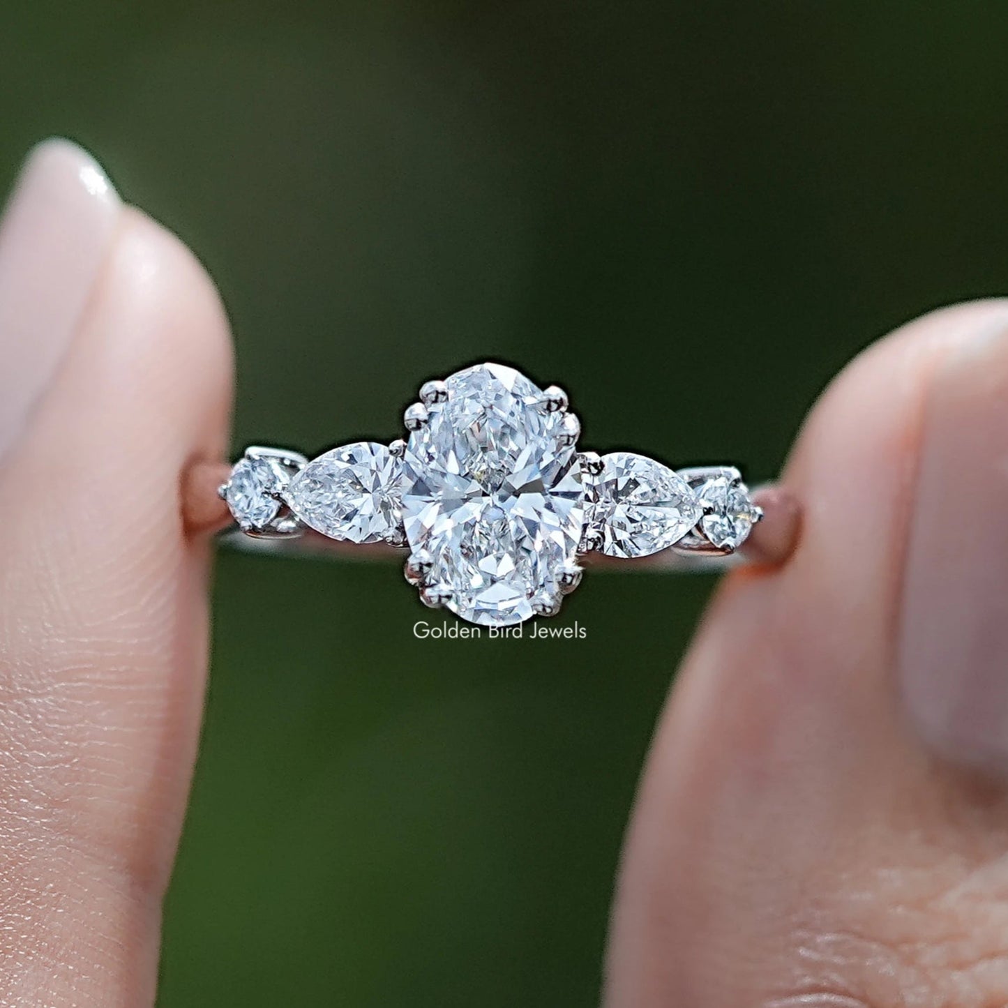 Oval And Pear Lab Diamond Five Stone Engagement Ring In Two Fingers