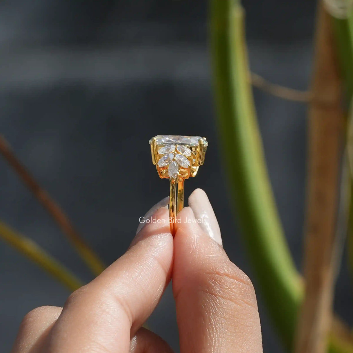 Side View of Oval Cut Moissanite Vintage Style Engagement Ring In two fingers
