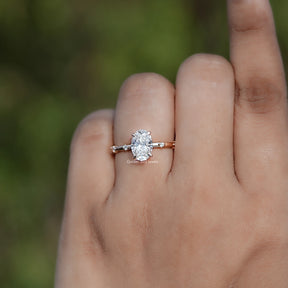 Front view of Oval Shaped Diamond Distance Ring