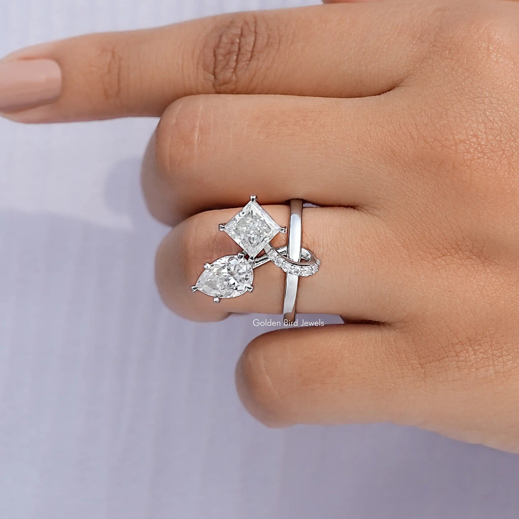 Close View Of Pear And Princess Cut Moissanite Ring
