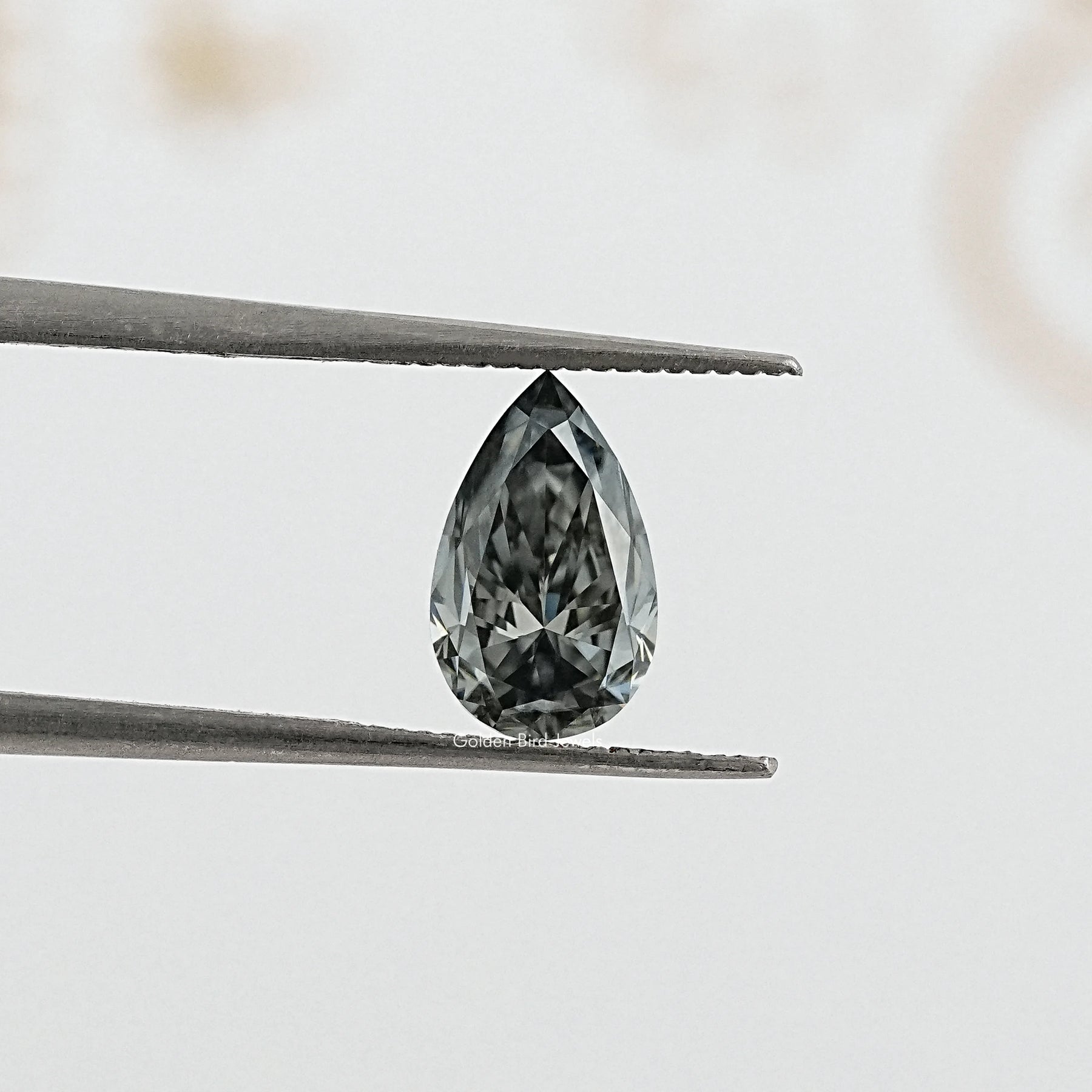 tweezers  View of Dazzling Gray Pear Cut Moissanite for Anniversary Rings