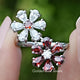 Front view of Pear Gemstone Flower Shape Cluster Bypass Ring in two fingers 