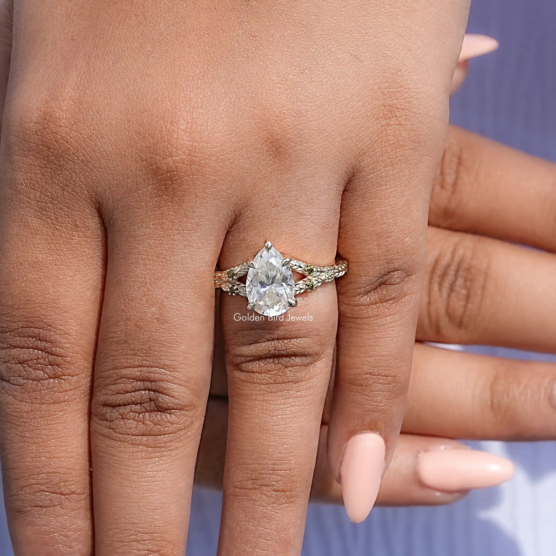 Detailed View Of Pear Cut Moissanite Accent Engagement Ring
