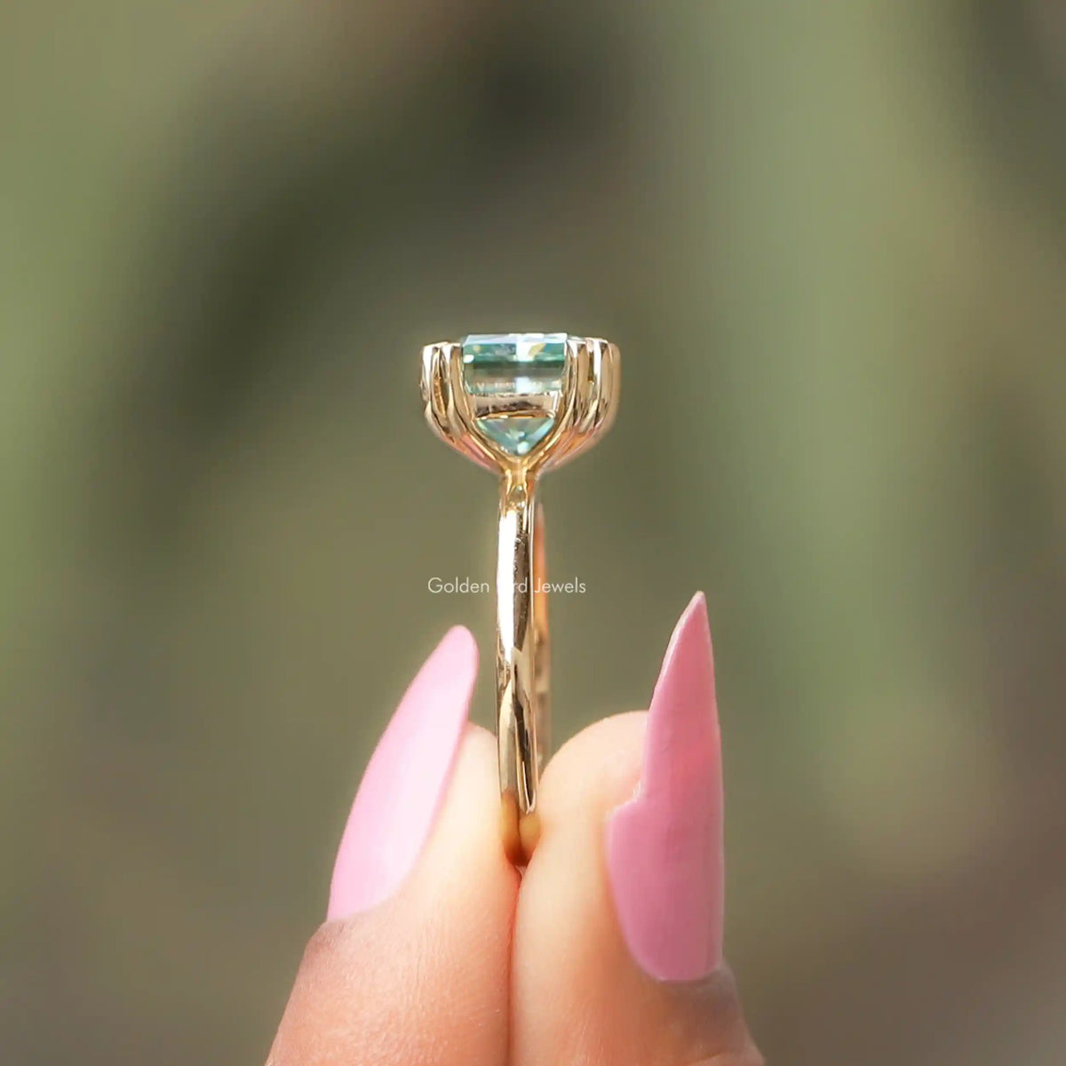 Side View of Radiant Cut Moissanite Ring In two fingers