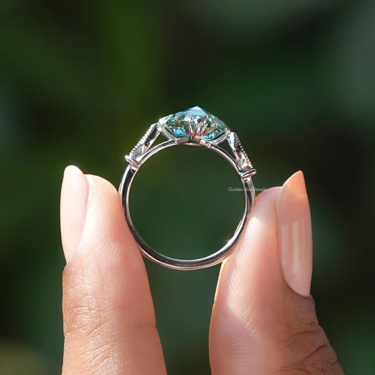 Back view of rose cut oval bridal ring with round accents