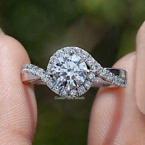 Round Cut Lab Grown Diamond Bypass Engagement Ring Held Between Fingers