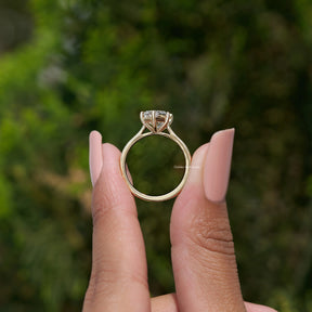 Back view A step cut Dutch marquise diamond ring in two fingers