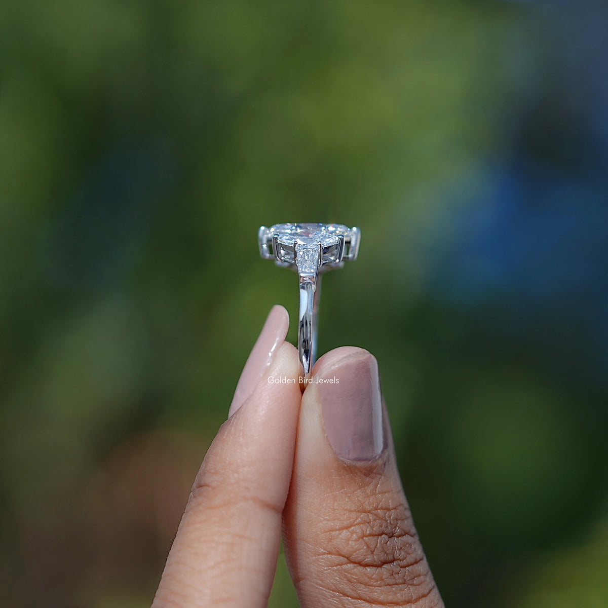 In hand showing view of lab diamond Ring	 		

