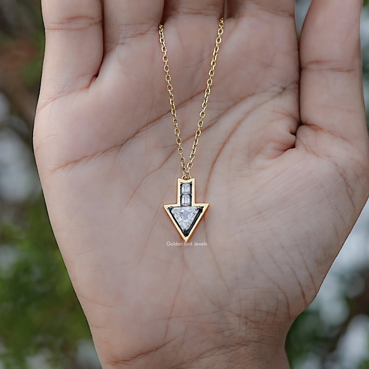 In hand Showing View Of Triangle And Baguette Moissanite Arrow Shape Pendant 